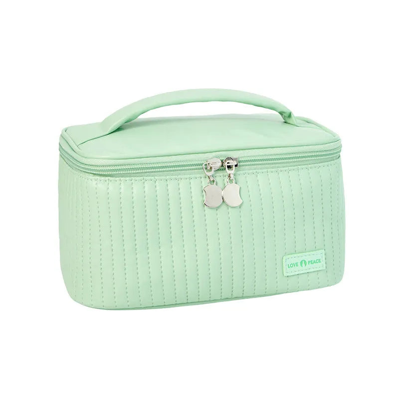 Open-top round cake-shaped makeup bag in a solid PU leather colour from the pink, coffee, beige, blue, green, purple range.