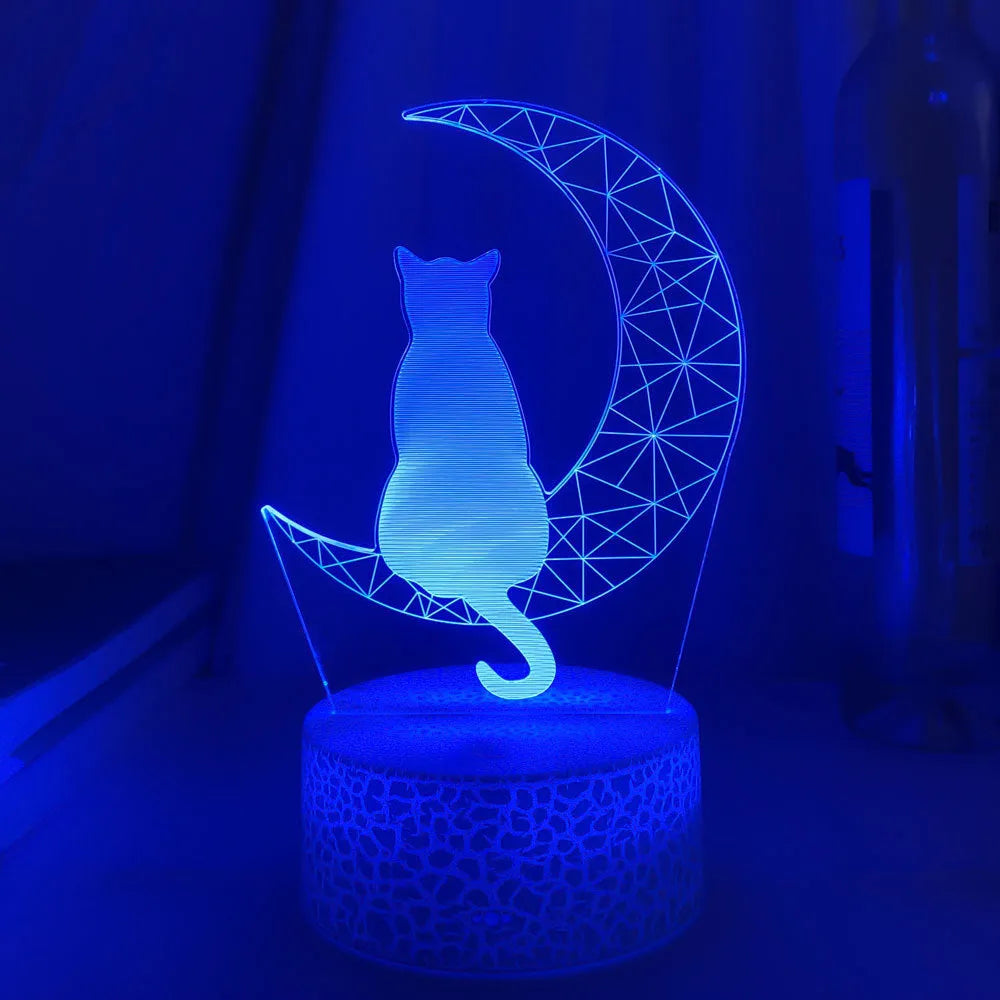 3D LED light moon and cat shape acrylic panel with remote control and USB cable on a dark surface