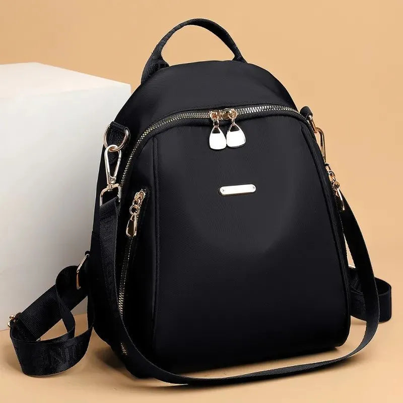 Women's Oxford cloth casual travel backpack in urban simplicity style with sewing line detail and sandwich pocket