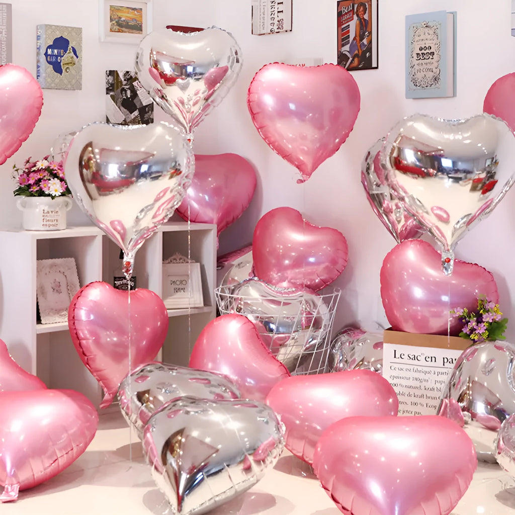 Five sparkling peach heart shaped aluminium balloons in assorted colours for party decoration.
