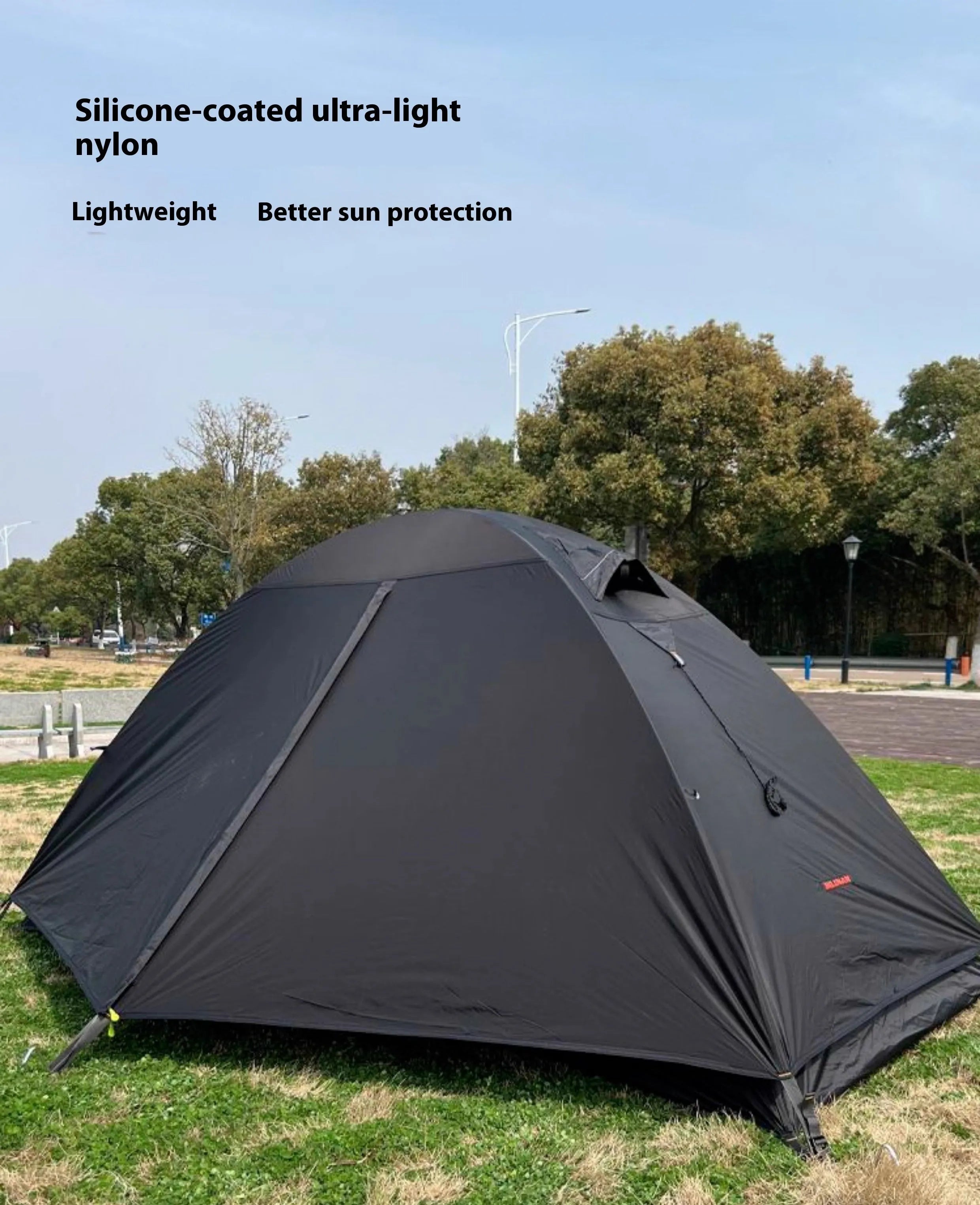 Single person hiking tent with aluminium poles shown in red colour with mesh ventilation panels visible