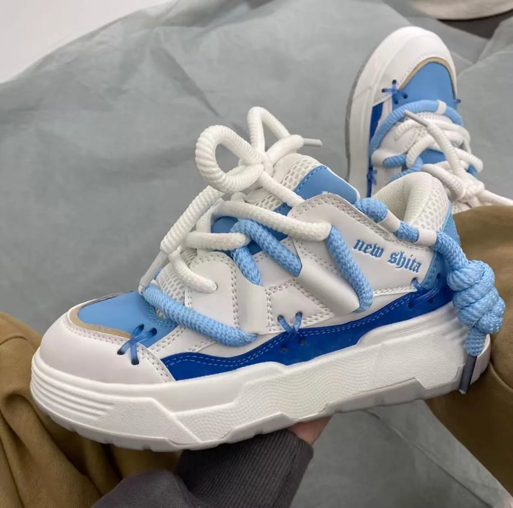 Women's grey retro clunky sneakers with thick rubber sole and lace-up front, showing 6-8cm heel height