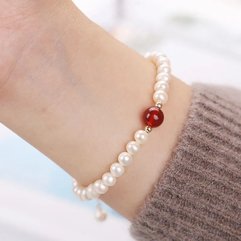 Chinese style glass bracelet with bamboo joint details in a red Lvzhu Duobao design.