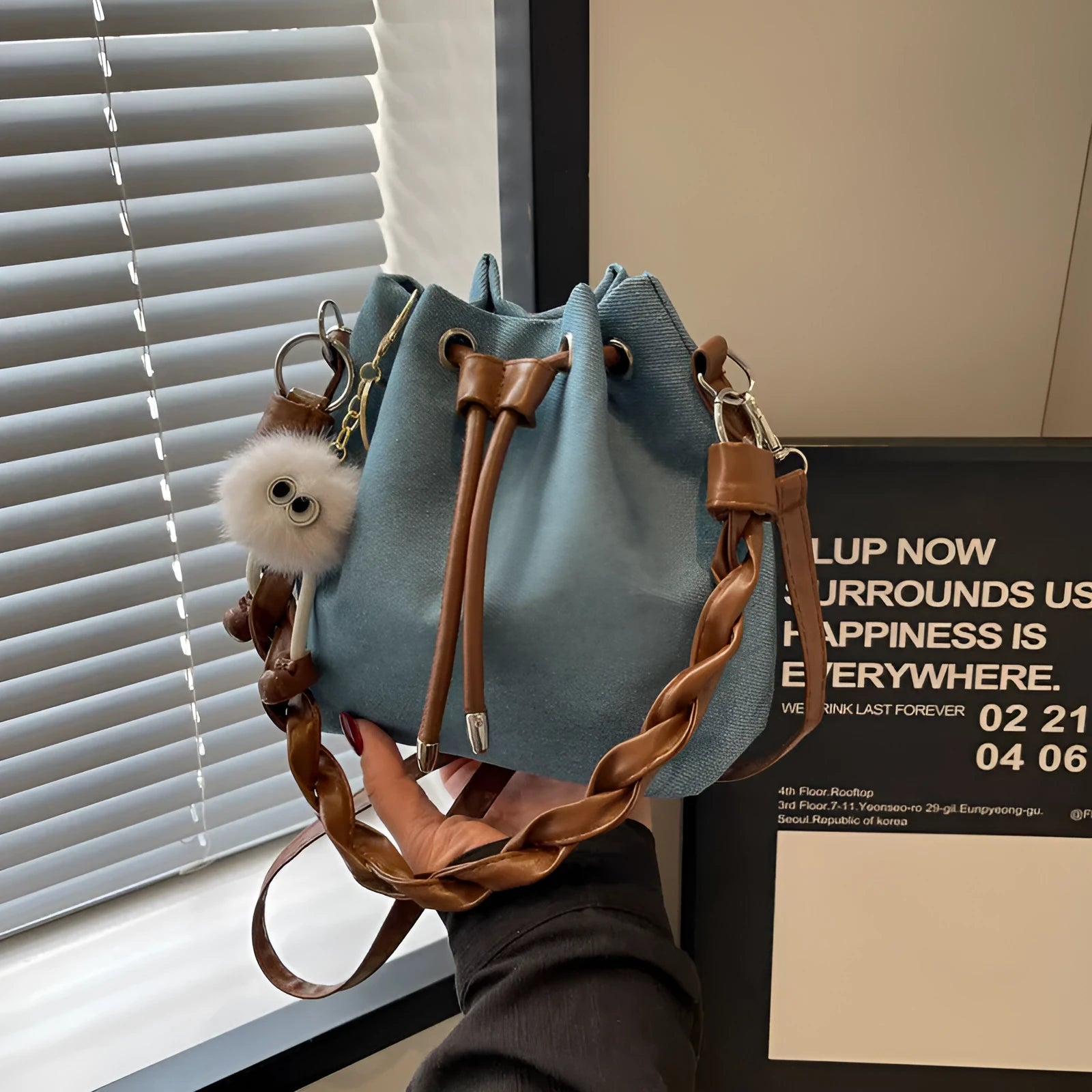 Blue synthetic leather one-shoulder cross-body bucket bag with optional hanging ornaments