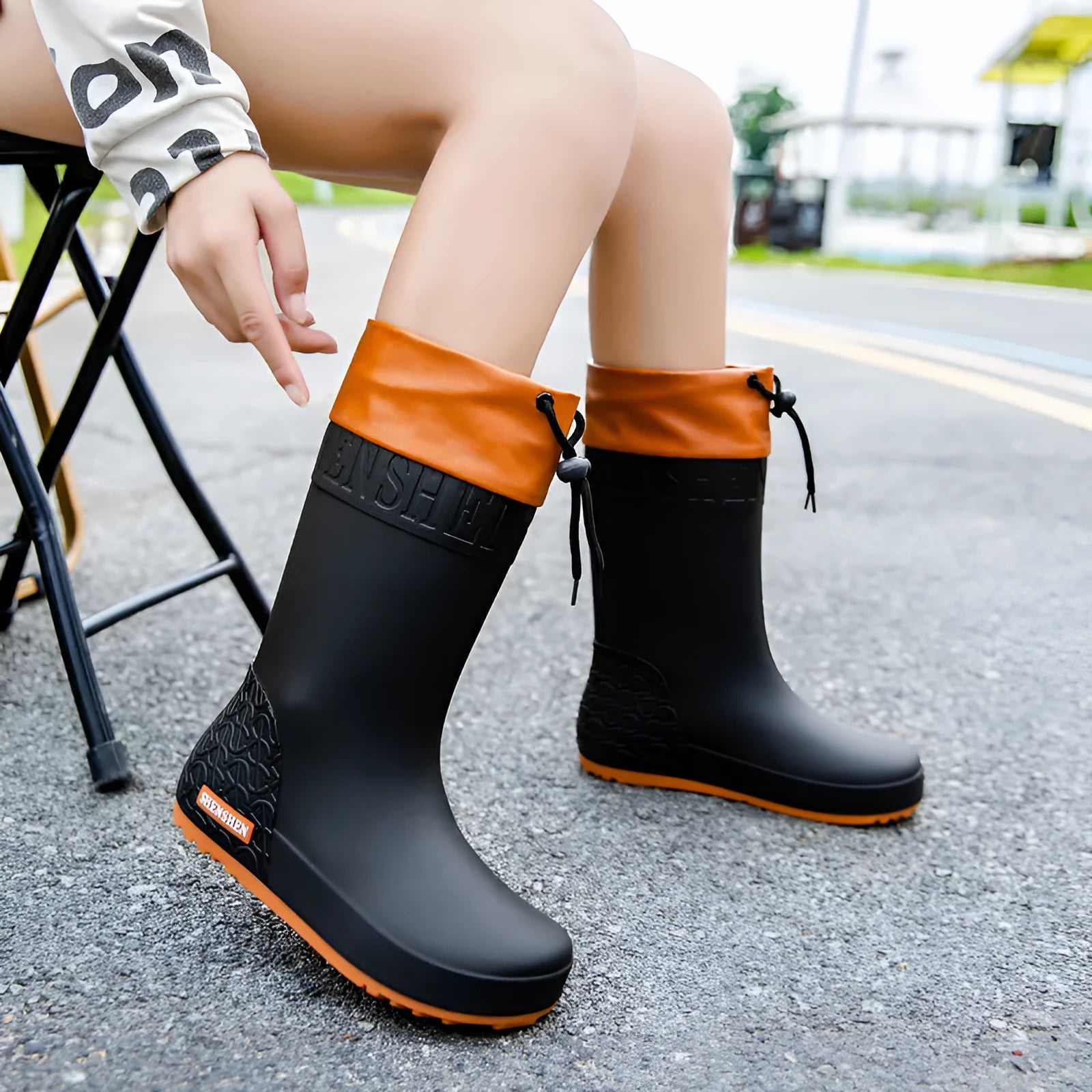 Women's solid colour PVC rain boots with non-slip soles in apricot, black, brown, and pink waterproof mouth options