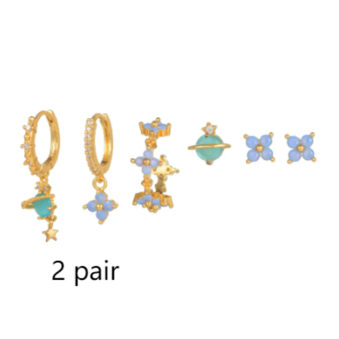 Flower-shaped stud earrings with zircon crystal centres in gold and silver colour options