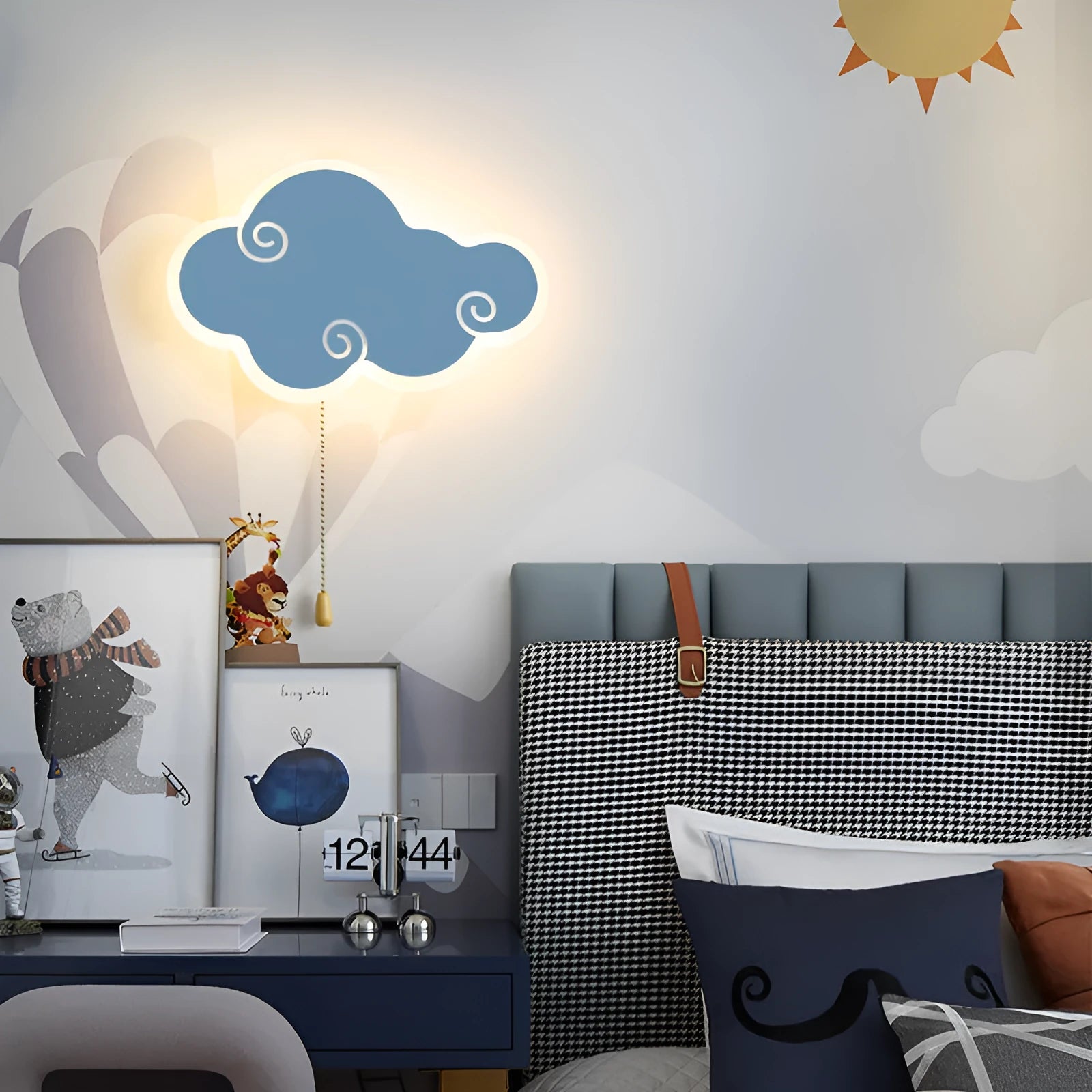 White cloud-shaped children's wall lamp with acrylic cover mounted on a bedroom wall.
