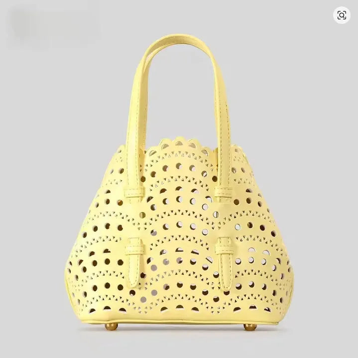 Hollow carved PU messenger bag with three shoulder straps in horizontal square shape