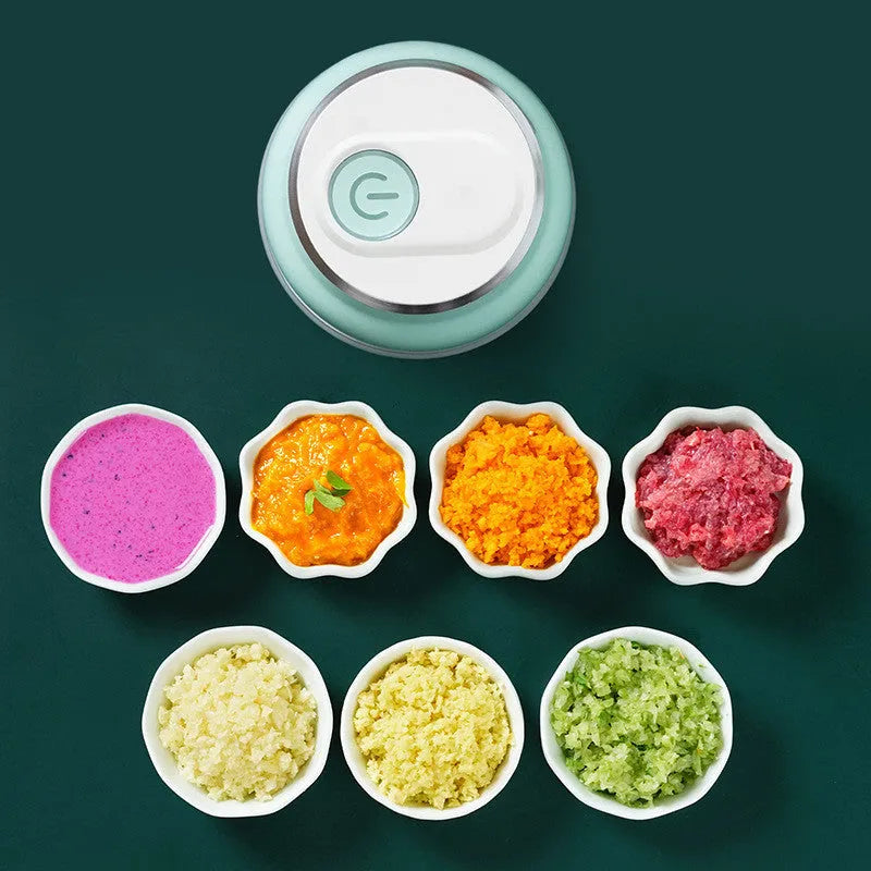 Green portable electric mini garlic cutter masher with transparent cup and USB cable, 150ml capacity on white background