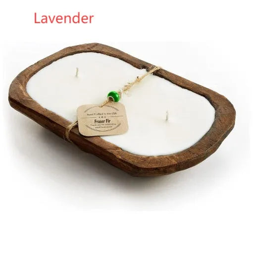 Lavender-coloured wooden basin containing a soy wax aromatherapy candle with three wicks.
