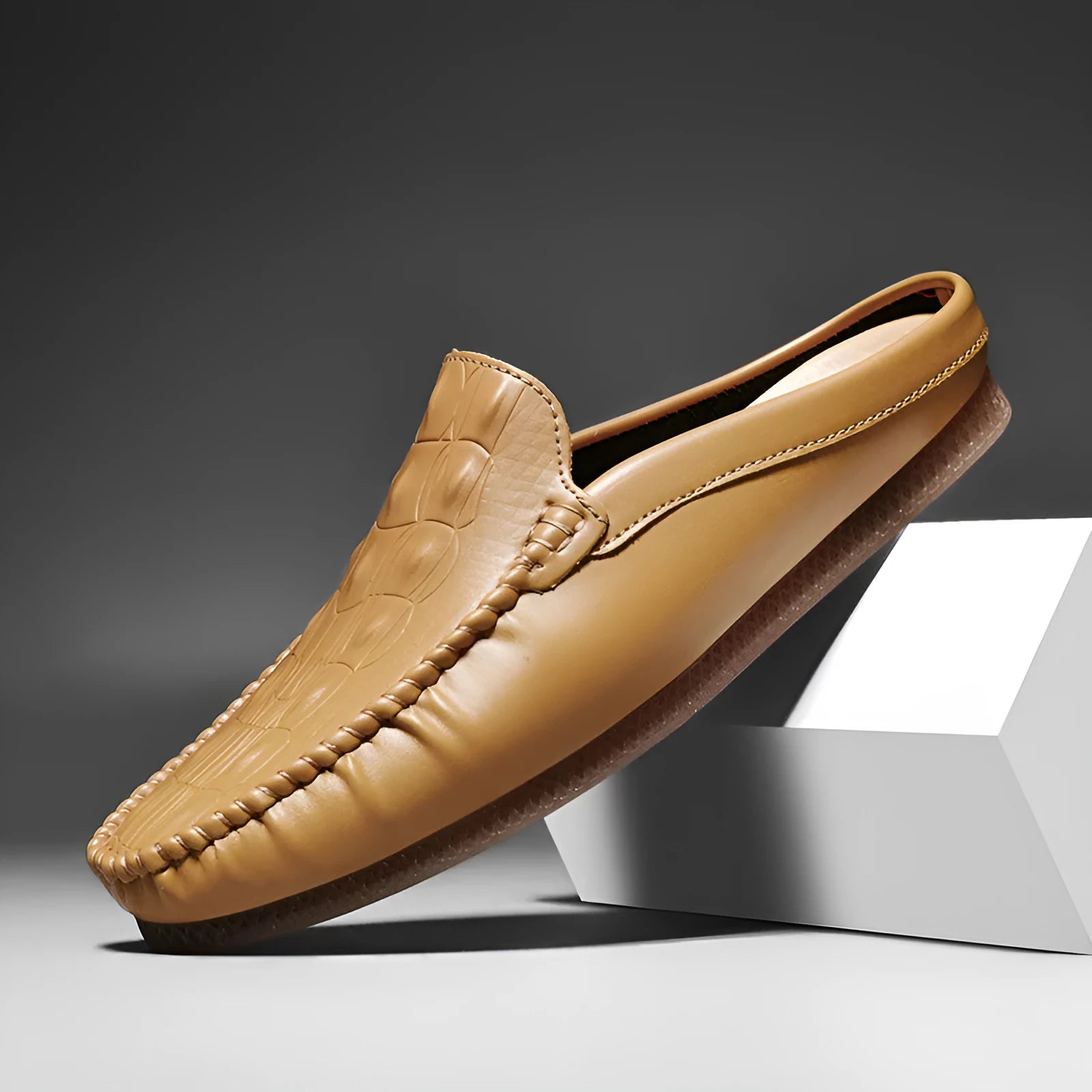 Men's black breathable semi-slippers with a textured rubber sole, shown from a side angle.