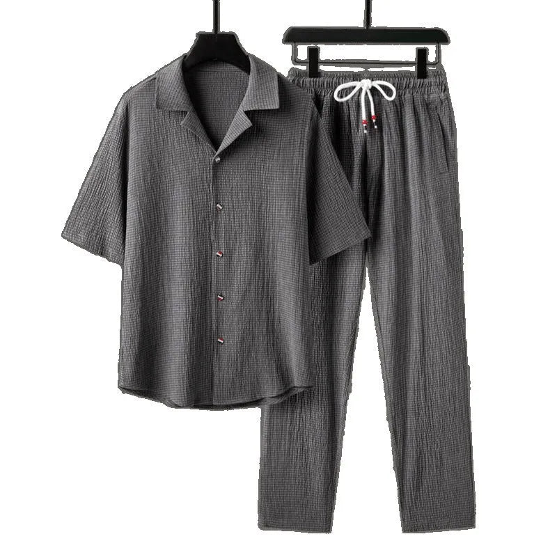 Men's national style two-piece sportswear set showing knitted half-sleeve top and full-length trousers