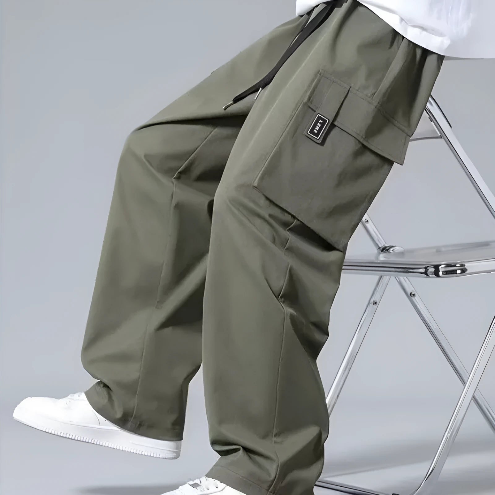 Boys' straight-leg cargo pants in army green with drawstring waist and multiple large pockets.
