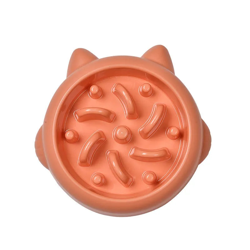 Green pet slow feeder bowl with raised bone-shaped obstacles inside to slow down eating.