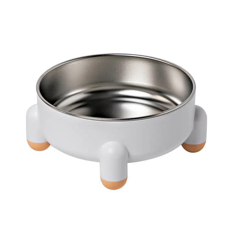 Green stainless steel pet bowl with a high foot and non-slip silicone base on a floor