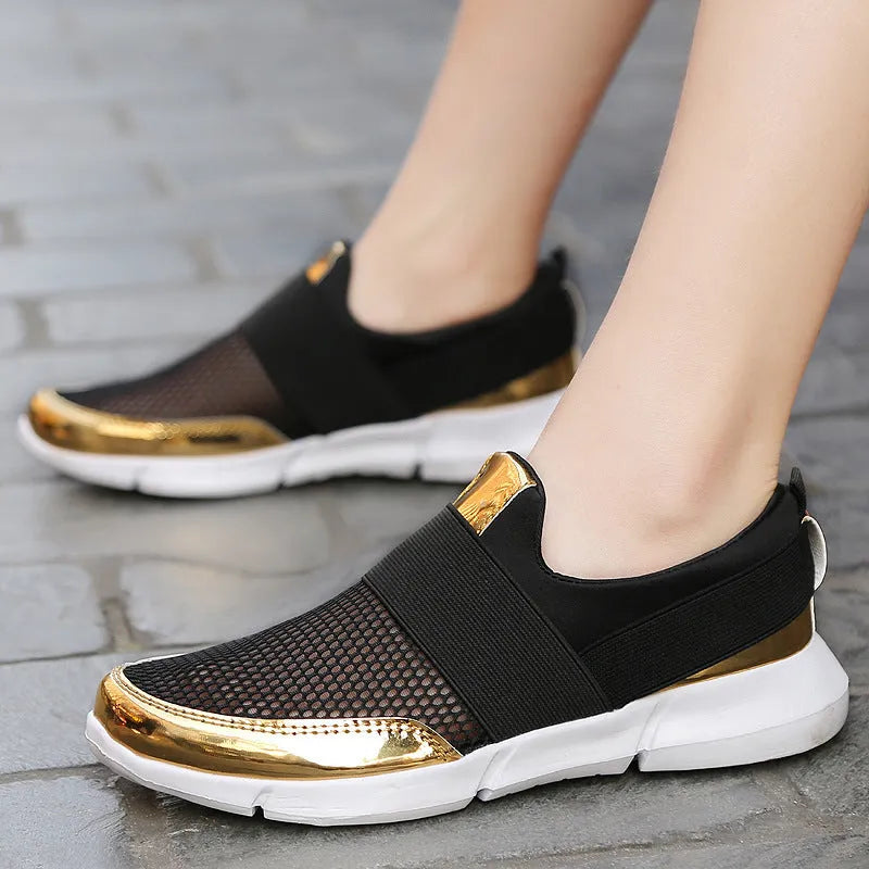 Blue, black, and grey low-top women's casual sneakers with mesh interior and PU midsole.