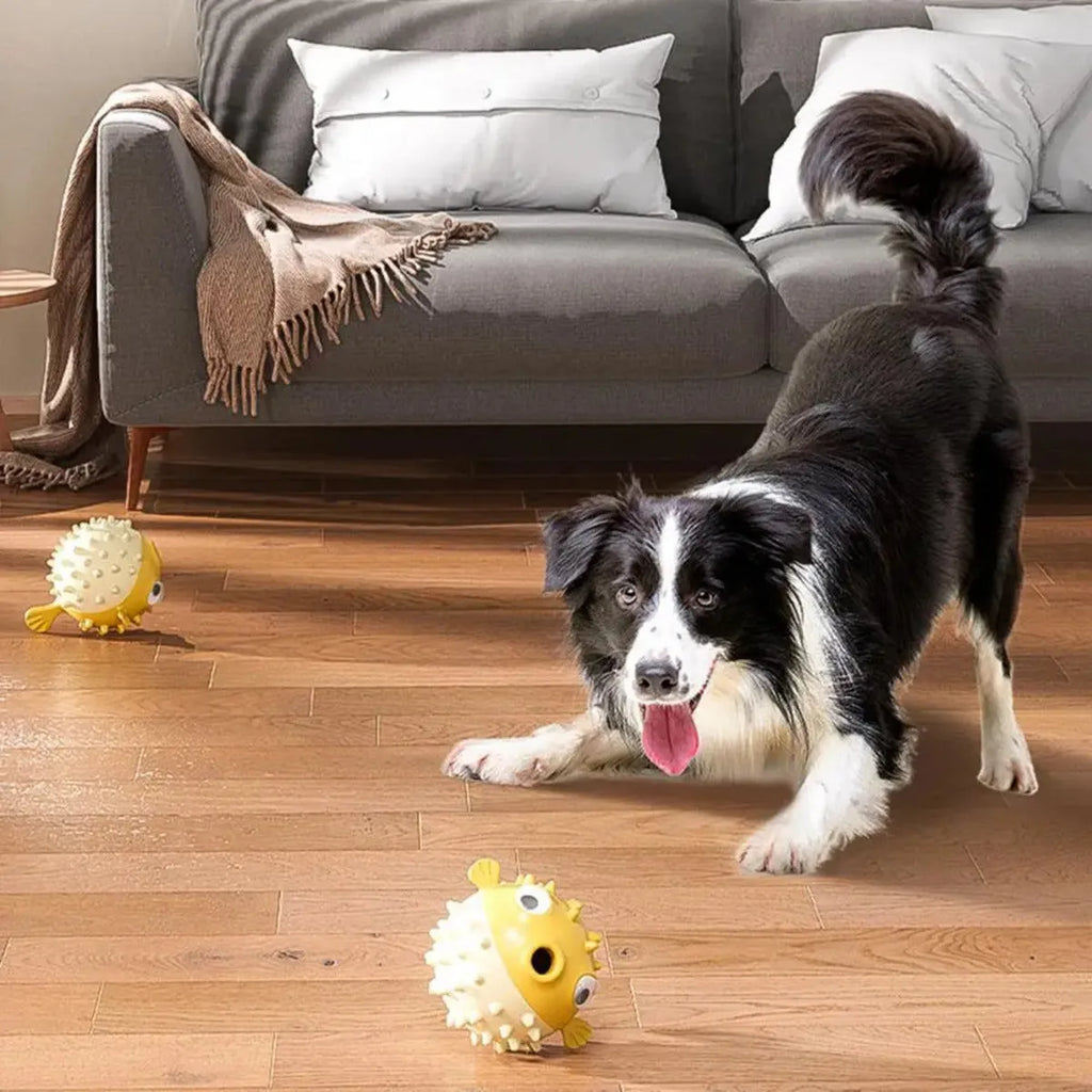 Yellow fish-shaped vinyl dog chew toy with textured surface for teeth cleaning.