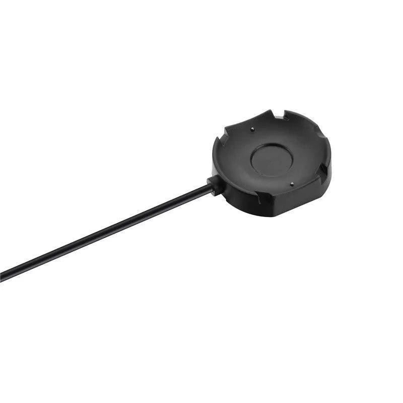 Black Withings Hybrid Smart Watch charging cable with magnetic probe on a desk