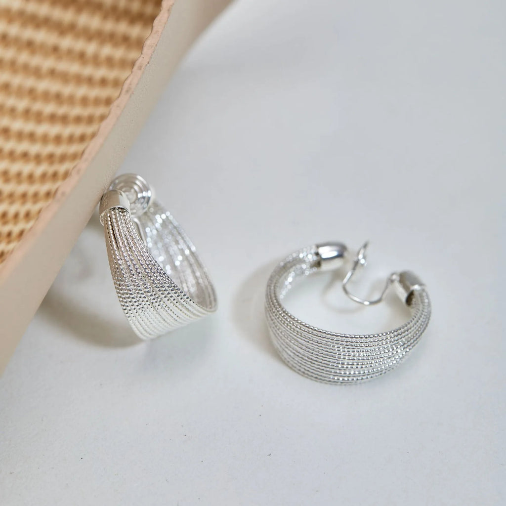 Simple geometric earrings and ear clips in silver and gold colour options