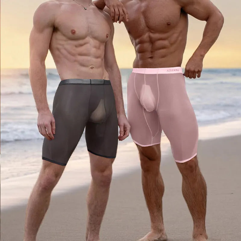 Men's solid-colour seamless nylon mesh shorts shown in black, white, and pink.