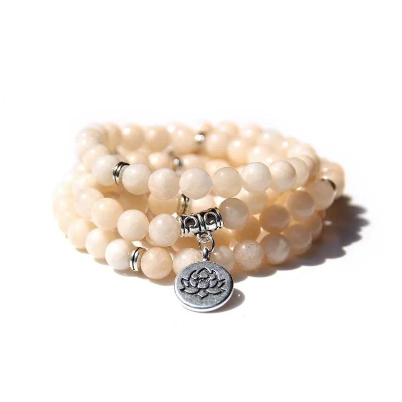 Women's bracelet with natural stone lotus pendant in geometric design showing eight colour variations