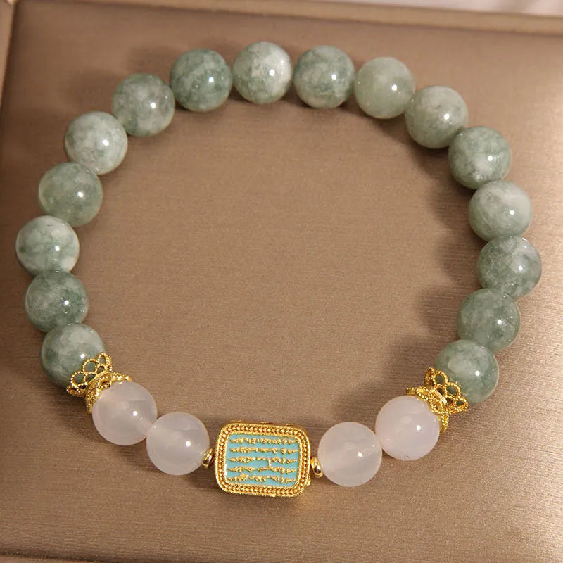 Women's oil green emerald crystal bracelet with five scripture bead design on wrist