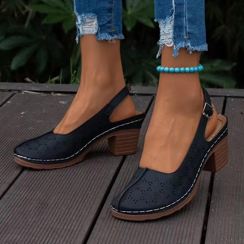 Women's black closed toe wedge sandals with a rounded toe and PU upper on a rubber sole.