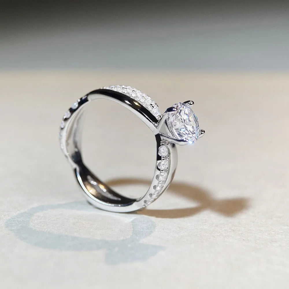 Silver geometric cross ring with 1 karat moissanite centre stone and twisted arm band