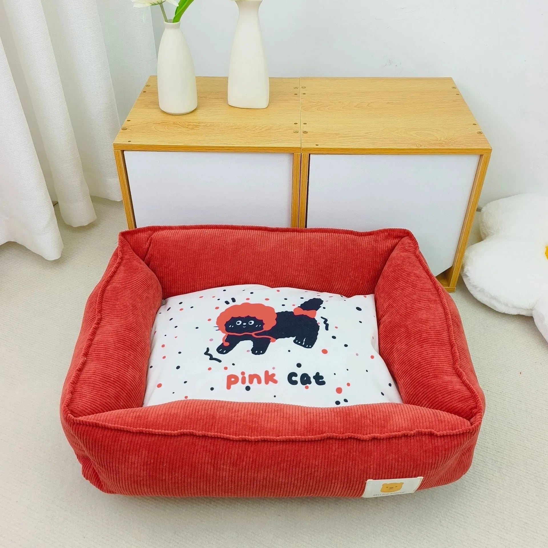 Light blue washable cotton pet winter nest for dogs and cats on a floor.