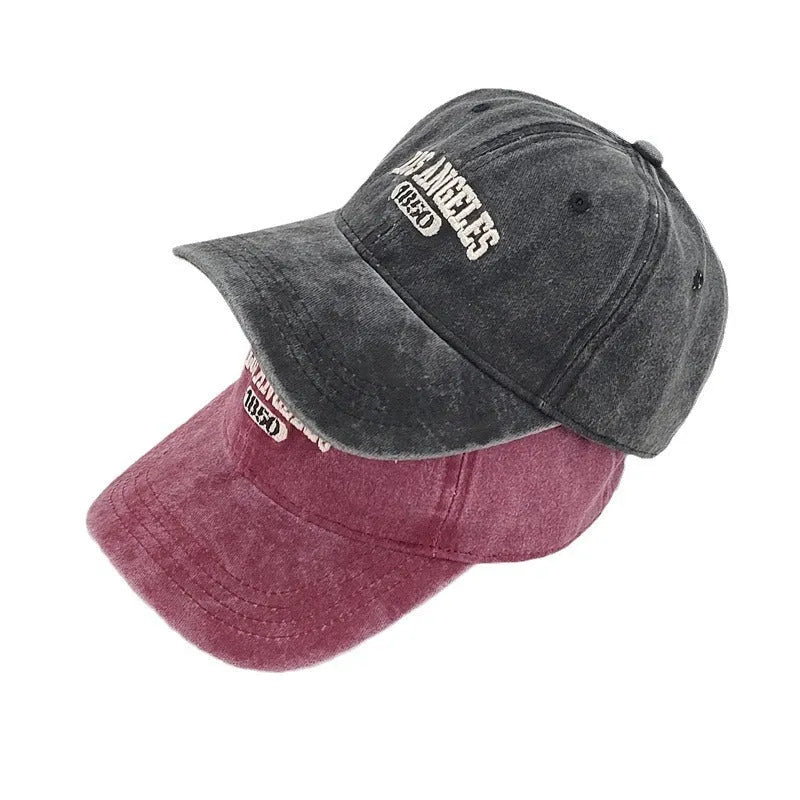 Retro-style personalised baseball cap with distressed letter embroidery on an adjustable strap, shown in beige colour.