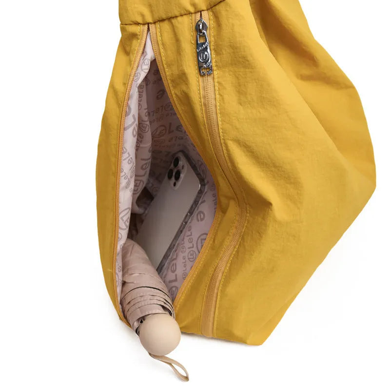 Women's soft nylon underarm bag in a heart shape, shown in black, blue, khaki, and yellow colour options.