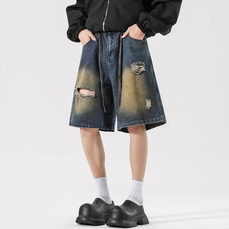 Men's loose-fit ripped jeans in retro blue cotton denim with streetwear styling