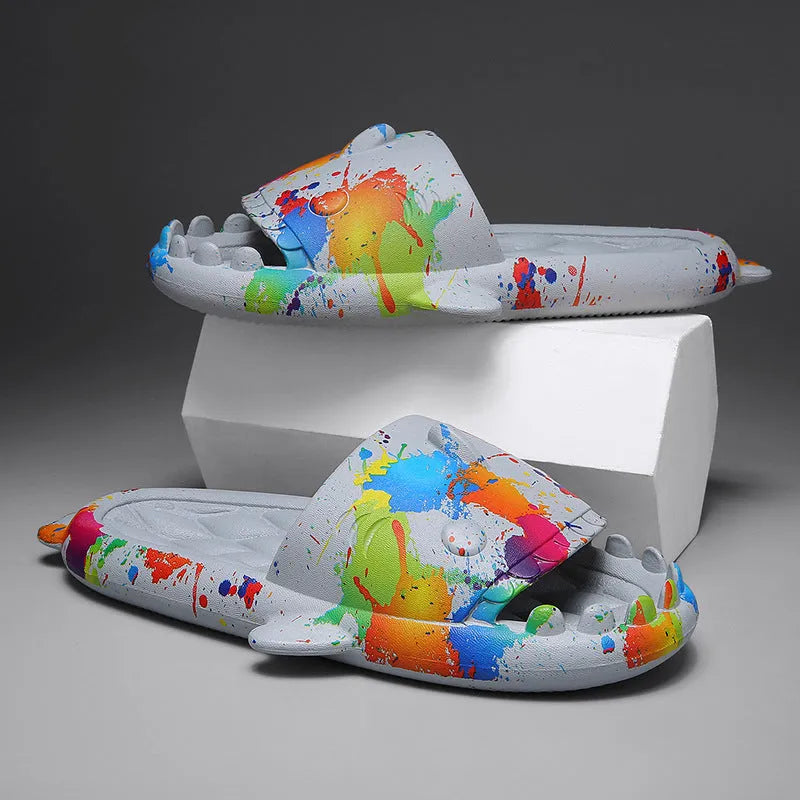 Beige and black EVA open-toe home slippers with a shark design on the front, shown as a couple's pair.