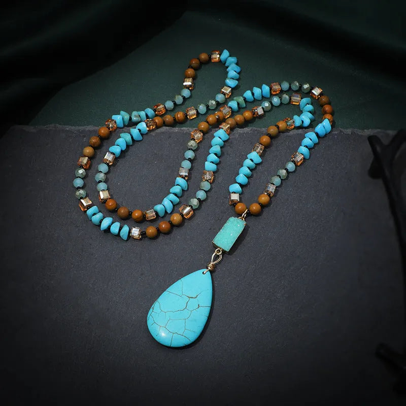 Turquoise water drop shaped pendant necklace with geometric design and ball bead chain