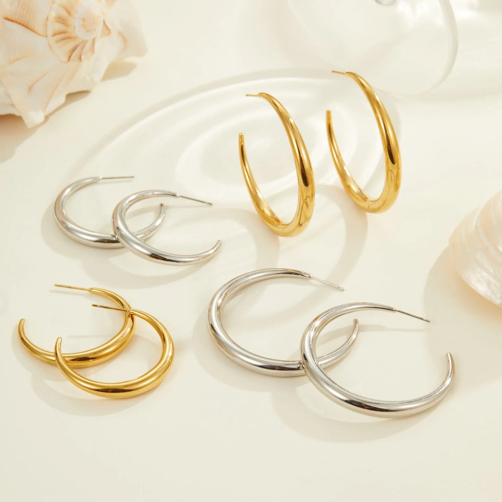 Geometric round titanium steel hoop earrings in gold and stainless steel finishes, small and large sizes