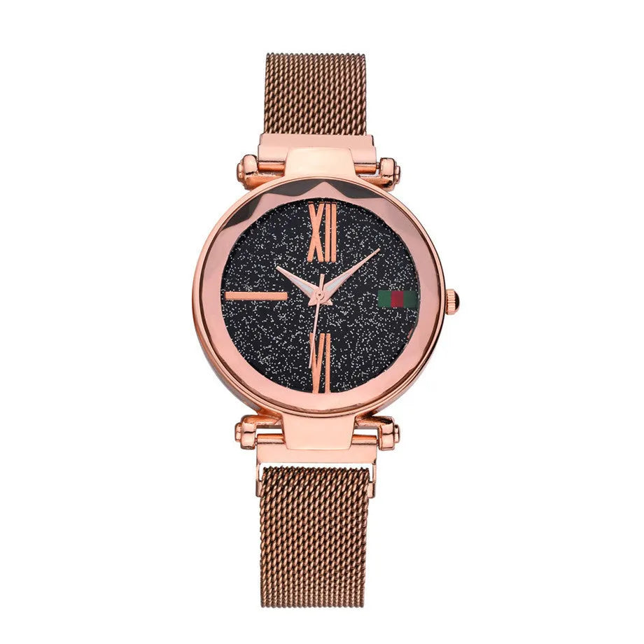 Ladies quartz wristwatch with round 32mm dial and stainless steel strap with magnetic buckle, shown in rose gold colour.