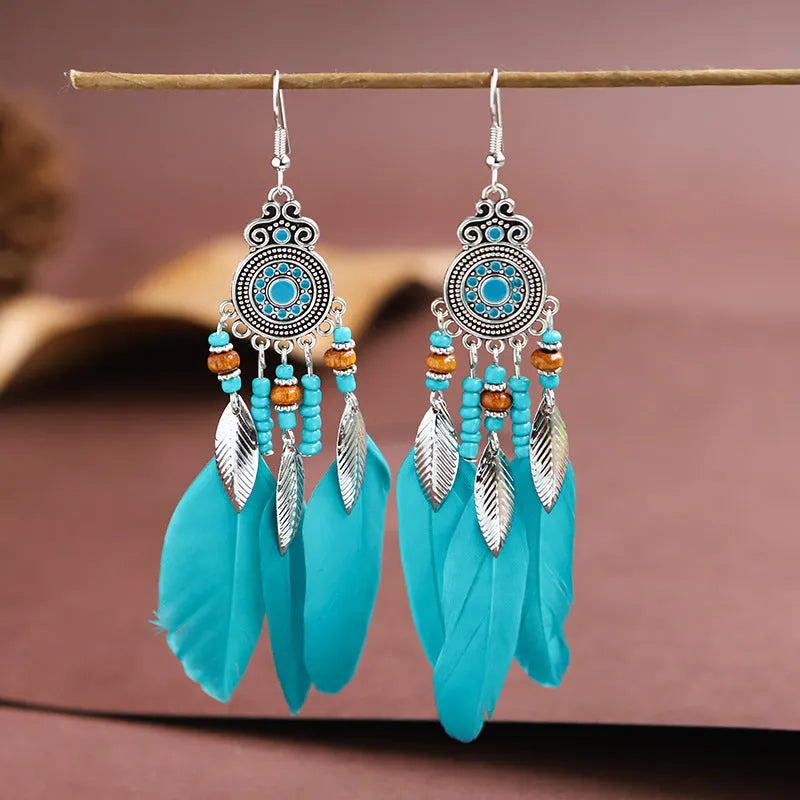 Round drop feather design alloy earrings with leaf pattern in a bohemian style, showing electroplated finish.