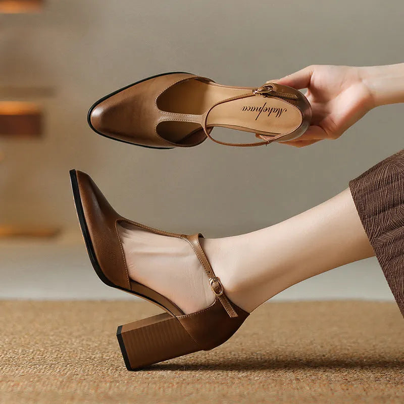 Women's pink retro Mary Jane shoes with a pointed toe, buckle strap, and cowhide leather upper.
