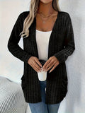 Women's solid colour long sleeve cardigan with pockets in loose fit, shown in Granny Grey.