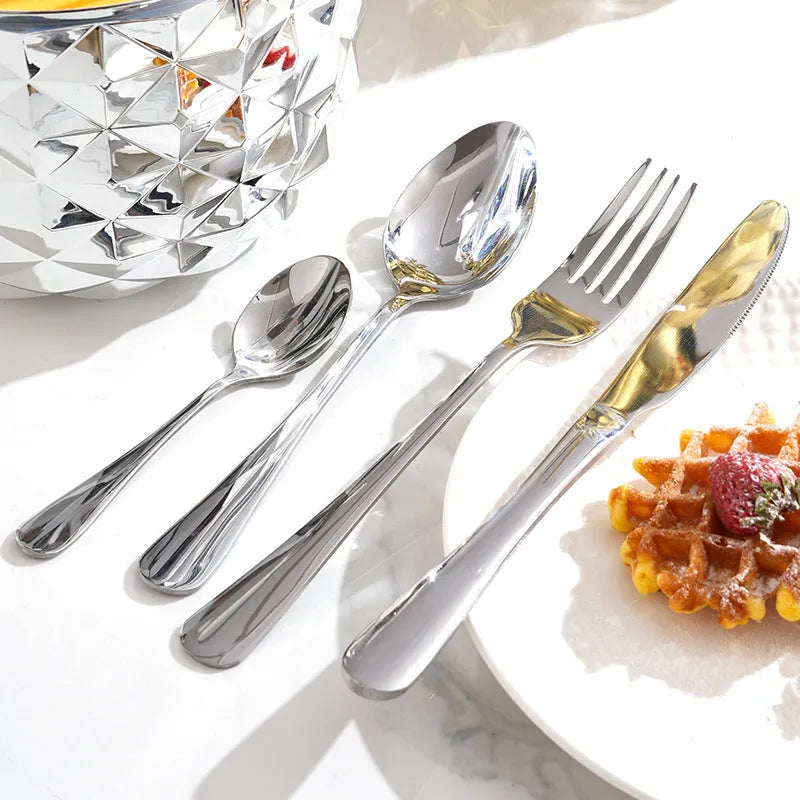 Fashion stainless steel 24-piece tableware set with mirror polish and pineapple egg design in gold finish on a dining table