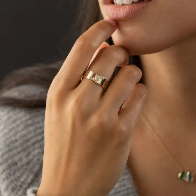 Women's gold electroplated copper ring with shining zircon detail showing personality style design