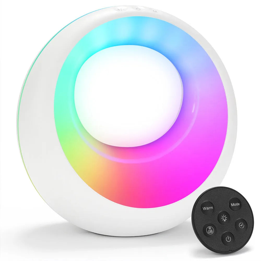 Creative Touch small white RGB colour changing night lamp with remote control on a wooden desk.