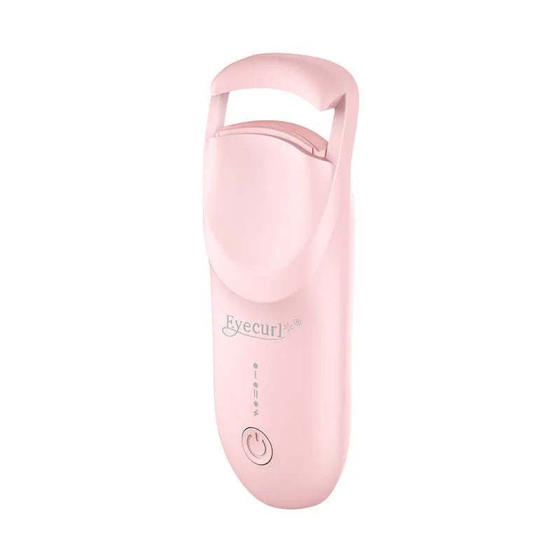 Electric heating eyelash curler in plastic housing with USB cable on a vanity