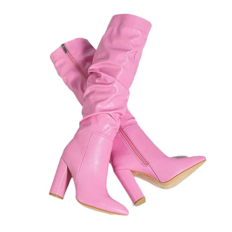 Women's long white pointed-toe high-heel boots with a side zipper, shown from the side.
