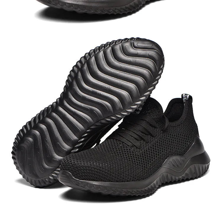Black steel toe cap safety shoes with anti-static properties and EVA construction on a work floor.