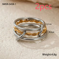 Stacked gold plated stainless steel rings showing layered jewellery look on female hand
