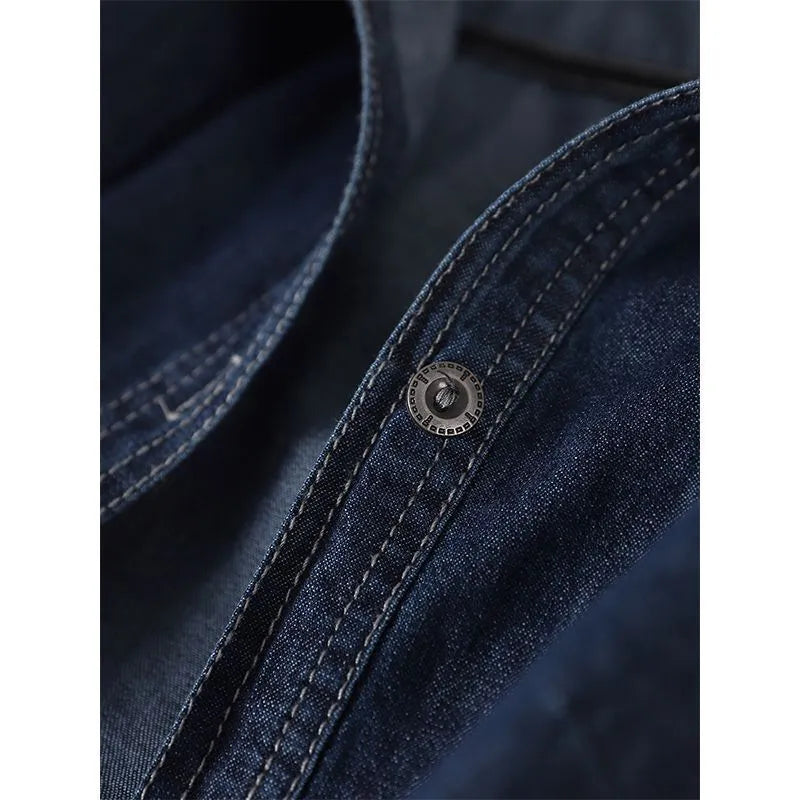 Solid colour hooded denim top in denim blue with large front pocket and long sleeves