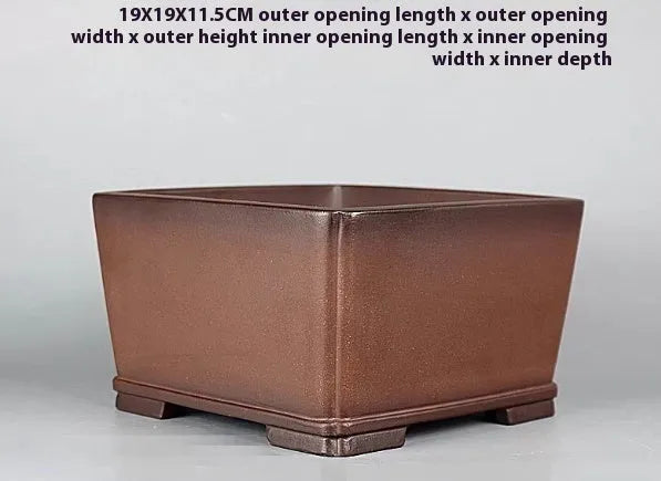 Brown handmade purple clay flower pot with antique styling and drainage hole