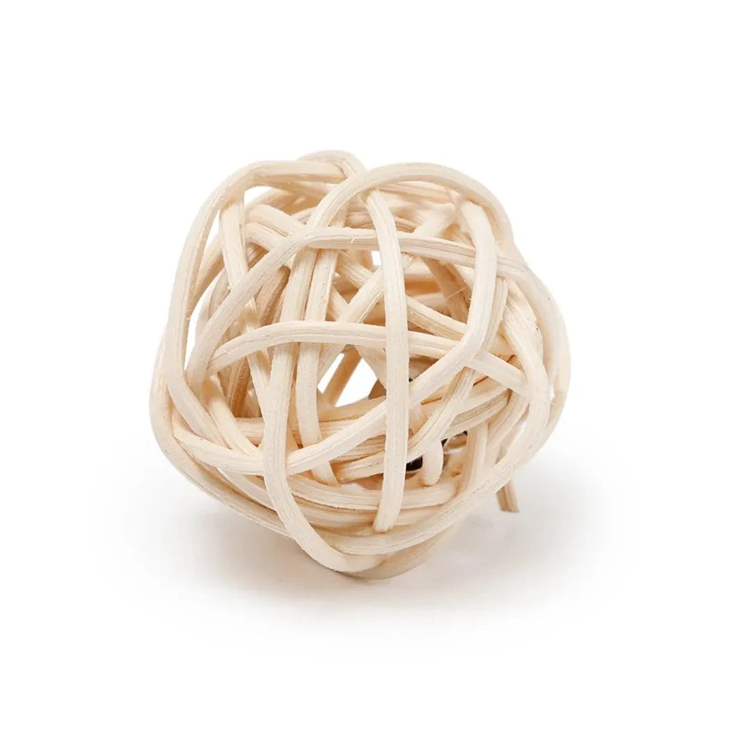 Two cat toys: a natural rattan ball and a colourful faux feather ball with a bell on a white background.