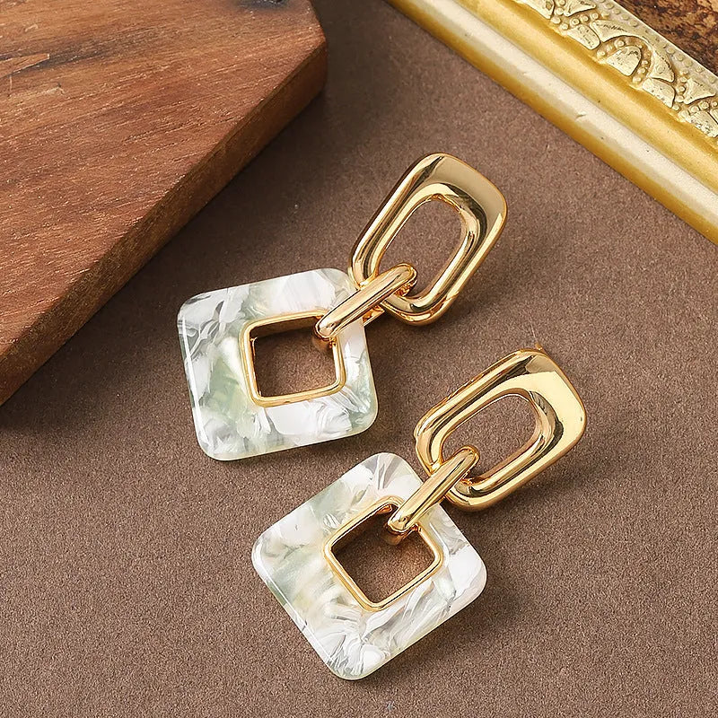 Hollow geometric square earrings with chamfered corners in silver or black